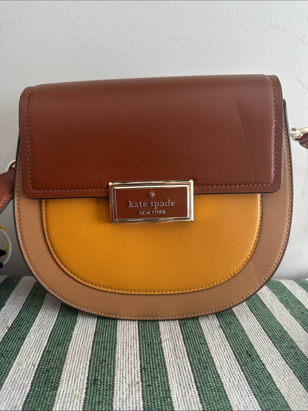 Kate Spade New York Reegan Colorblock Saddle Bag in the "Squash Blossom Multi"